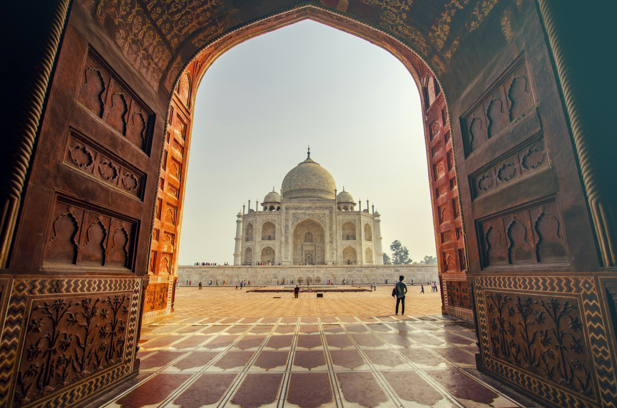 Taj Mahal at sunrise with reflecting pool